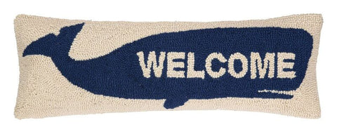 Classic nautical swimming whale on rectangular lumbar pillow. Navy whale on a white hook pillow, with WELCOME written across the whale in white capital letters. www.coast-to-home.com