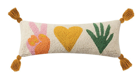 Peace love plants lumbar pillow with 4 corner tassels. Multi-colored symbols in muted shades of pink, orange and green on a white background. This rectangular shape looks great on a chair, bed, sofa or entry way. www.coast-to-home.com